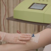 Blood Ozone Therapy. Woman At Blood Transfusion Treatment; Shutterstock ID 1999137539; other: -; purchase_order: -; client: -; job: -